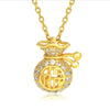 Gold-tone money bag pendant with an openwork Fu character, set with small clear stones, on a gold-tone chain