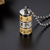 Gold and silver-tone prayer wheel pendant engraved with mantra characters and lotus petals, on a bead chain
