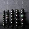Black obsidian bead bracelets showing rainbow colors in the light