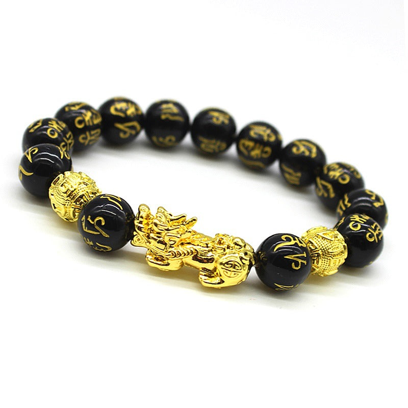 Gold-tone Pixiu charm on a black beaded FengShui bracelet
