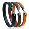 Three vintage leather bracelets in black, brown, and tan with silver-tone buckles