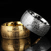 Two wide band rings with engraved characters, one in gold tone and one in silver tone