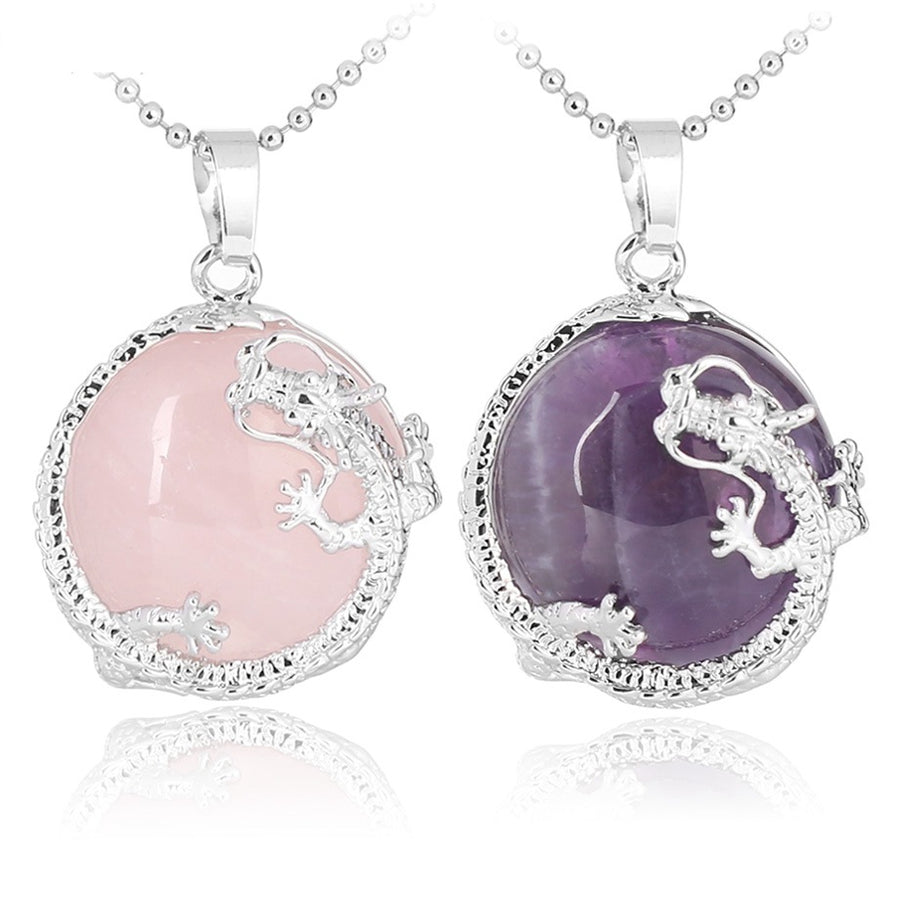 Two Chinese Dragon pendants, one in pink Rose Quartz and one in purple Amethyst, on silver-tone chains.