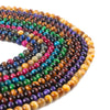 Coiled strands of colorful polished tiger eye beads on a white background