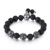 Close up of a tiger eye bead bracelet with silver tone mantra beads