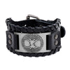 Close up of black leather bracelet with silver tree of life plate