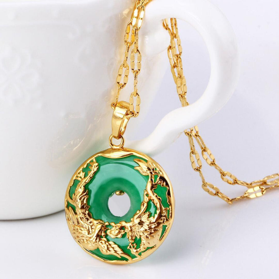 Gold tone necklace with green jadeite dragon and phoenix peace buckle pendant