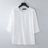 White loose fit cotton linen t-shirt with elbow length sleeves on a hanger
