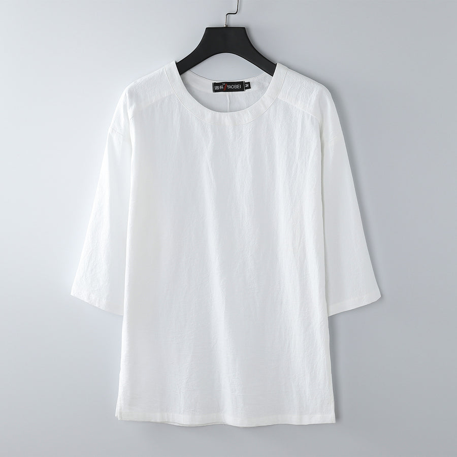 White loose fit cotton linen t-shirt with elbow length sleeves on a hanger