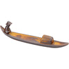 Brown ceramic incense burner shaped like a boat with a small fisherman figure