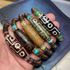 Five variations of a Tibetan nine-eye Dzi bead bracelet with coconut shell beads