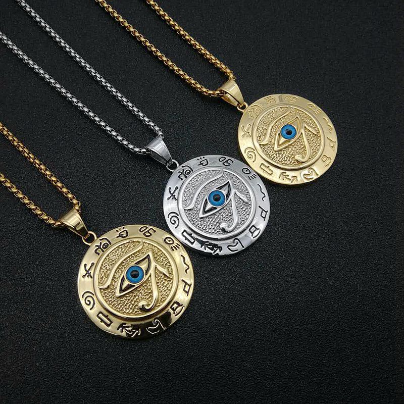 Gold and silver Eye of Horus pendants on chains