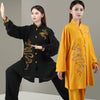 Two models wearing black and yellow cloud embroidered Tai Chi suits