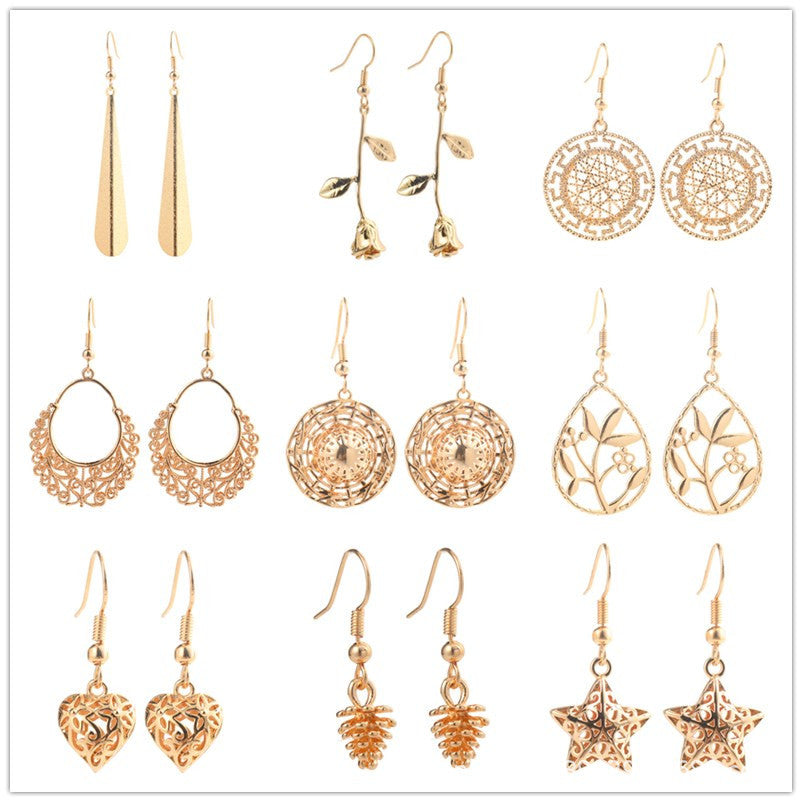 Gold-tone copper drop earrings with an openwork leaf design