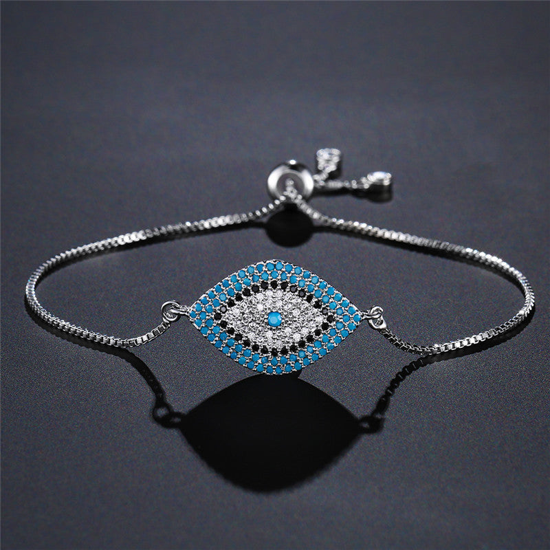 Evil eye protection bracelet with blue zircon stones on a silver-tone chain