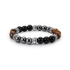 Close up of black agate beaded bracelet with silver accents on white background