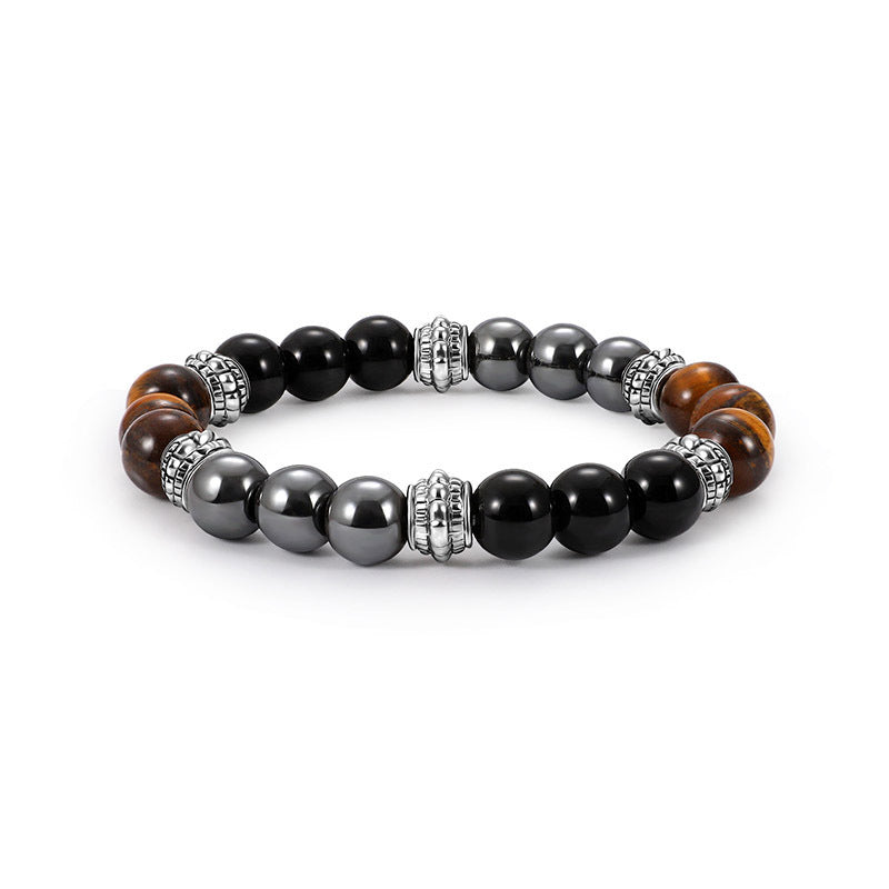 Close up of black agate beaded bracelet with silver accents on white background