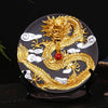 Ceramic backflow incense burner with a raised golden dragon and white clouds on a dark background
