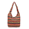 Large floral print cotton shoulder bag in red tones with a knotted strap detail