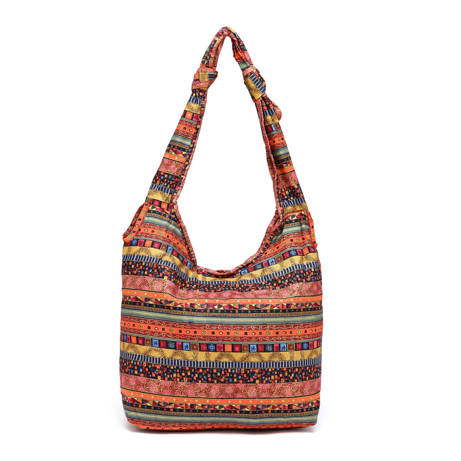 Large floral print cotton shoulder bag in red tones with a knotted strap detail