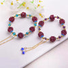 Garnet Cluster Bracelet with Gold-Tone Chain and Floral Accents