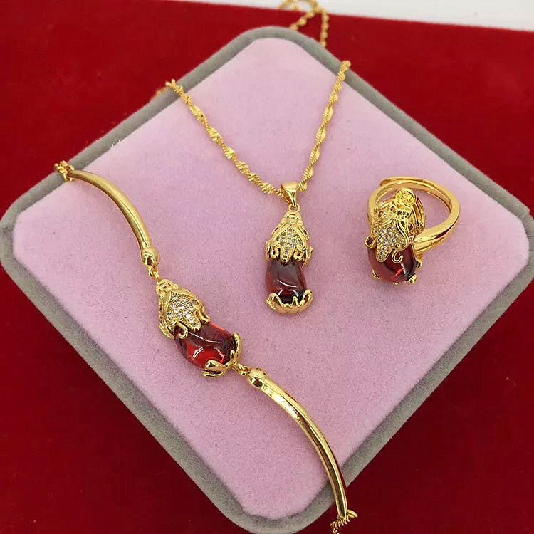 Gold plated Pixiu jewelry set with red faux gemstone including bracelet, ring and pendant