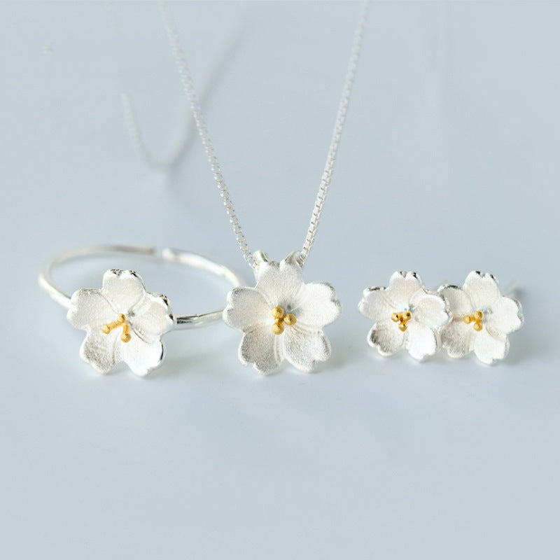 Silver tone cherry blossom flower necklace pendant on a chain