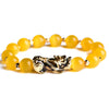 Gold-tone Pixiu charm on yellow cat's eye stone beads