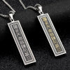 Two stainless steel pendants showing the Nine-word Mantra on one side and Yin Yang on the other