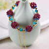 Garnet Cluster Bracelet with Gold-Tone Chain and Floral Accents