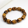 Close-up view of a natural tiger eye stone bracelet with polished oval beads