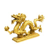 Gold-tone brass dragon statue on a rectangular base holding a sphere