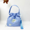 Embroidered Drawstring Bucket Bag with Tassel, Floral and Animal Motifs