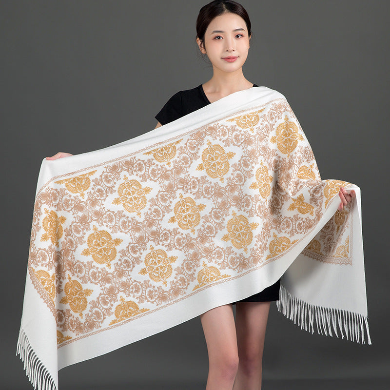 Woman wearing a white shawl with gold embroidered crown and floral patterns