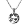 Close up view of a round silver pendant showing two fish swimming in a circle