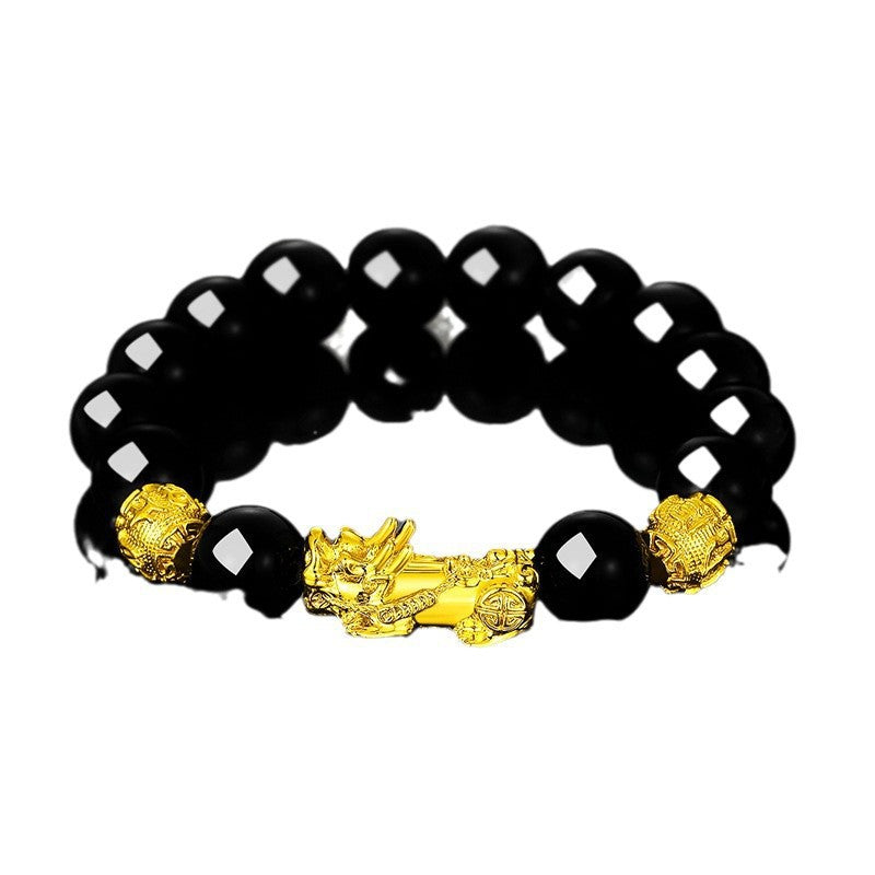 Black beaded bracelet with gold dragon and pixiu charms on white background