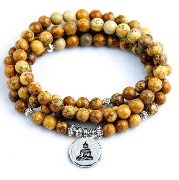 Coiled 108 bead agate mala bracelet with a silver-tone Buddha pendant on a white background