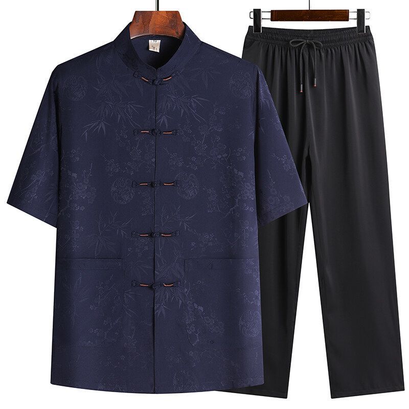 Navy blue short sleeve Tang suit top paired with black drawstring pants