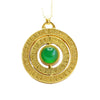 Close up of a round gold pendant with a green stone center and rotating ring