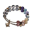 Multi-colored crystal bead bracelet with a gold star charm on a white background
