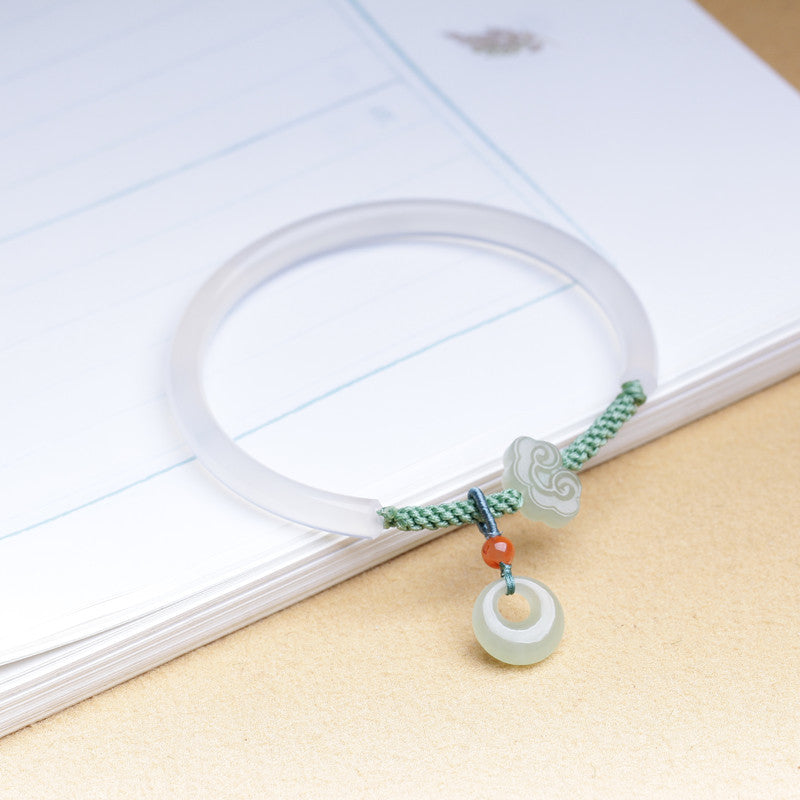 White agate half bangle with green cord and jade cloud charm