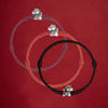 Three braided cord bracelets with silver horse charms on a red background
