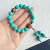 Turquoise Bracelet with Tibetan Style Beads and Charm