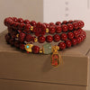 Cinnabar Triple Wrap Bracelet with Gourd and Flower Charms