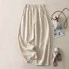 Flat lay of relaxed fit wide leg trousers in black, purple, pink, beige and white