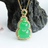 Green chalcedony gourd pendant on a gold tone chain against a dark rock background
