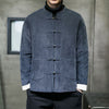 Man wearing a navy blue men's jacket with frog buttons
