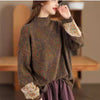 Model wearing a brown floral print long sleeve mock neck cotton sweater