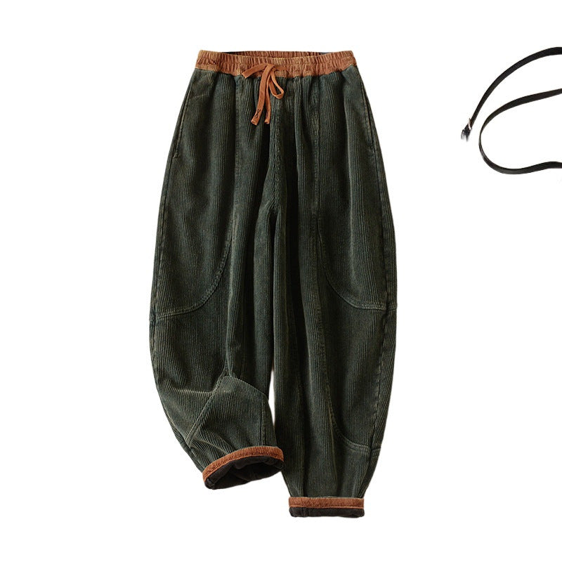 Dark green corduroy women's harem pants with brown trim and drawstring waist