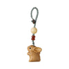 Carved white sandalwood rabbit hanging from a green cord loop with cream and dark beads.